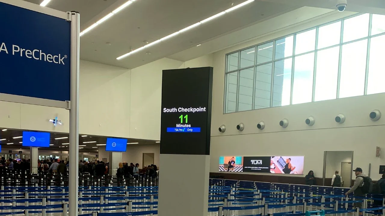 Screen displaying TSA wait times at Atlanta airport
